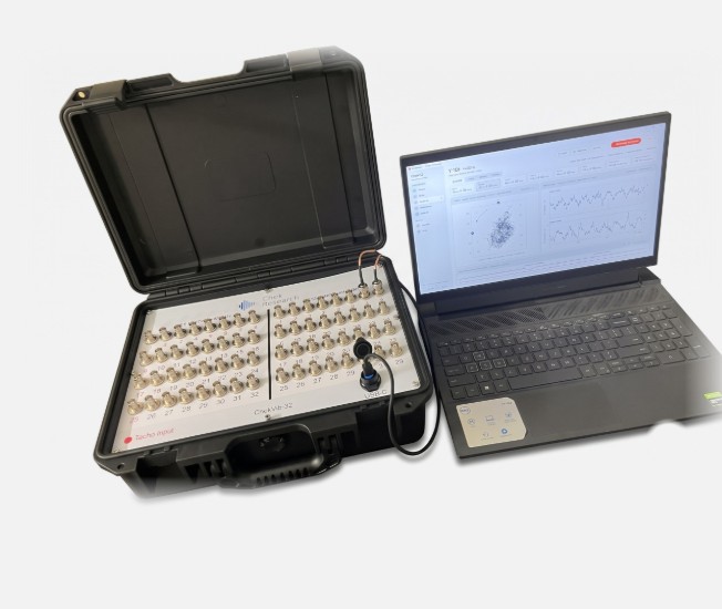 ChekVib-32 online monitoring system: a rugged case with 32 input channels and a laptop running the monitoring software